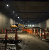 Highway underpass construction underway using advanced equipment